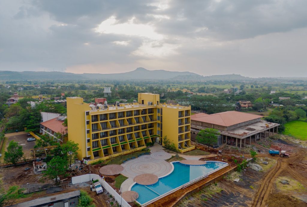 Scenic view from one of the best resorts near mumbai for couples showing misty hills