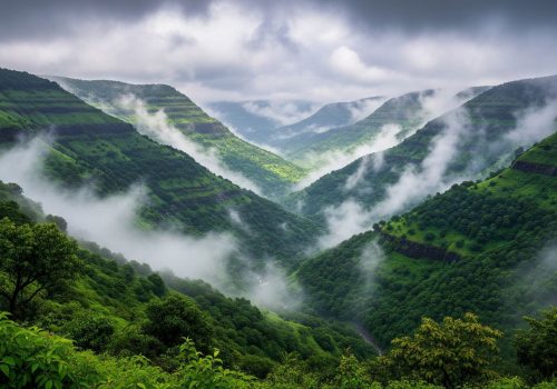 Panoramic view of Igatpuri valley during monsoon with lush green hills and low-hanging clouds